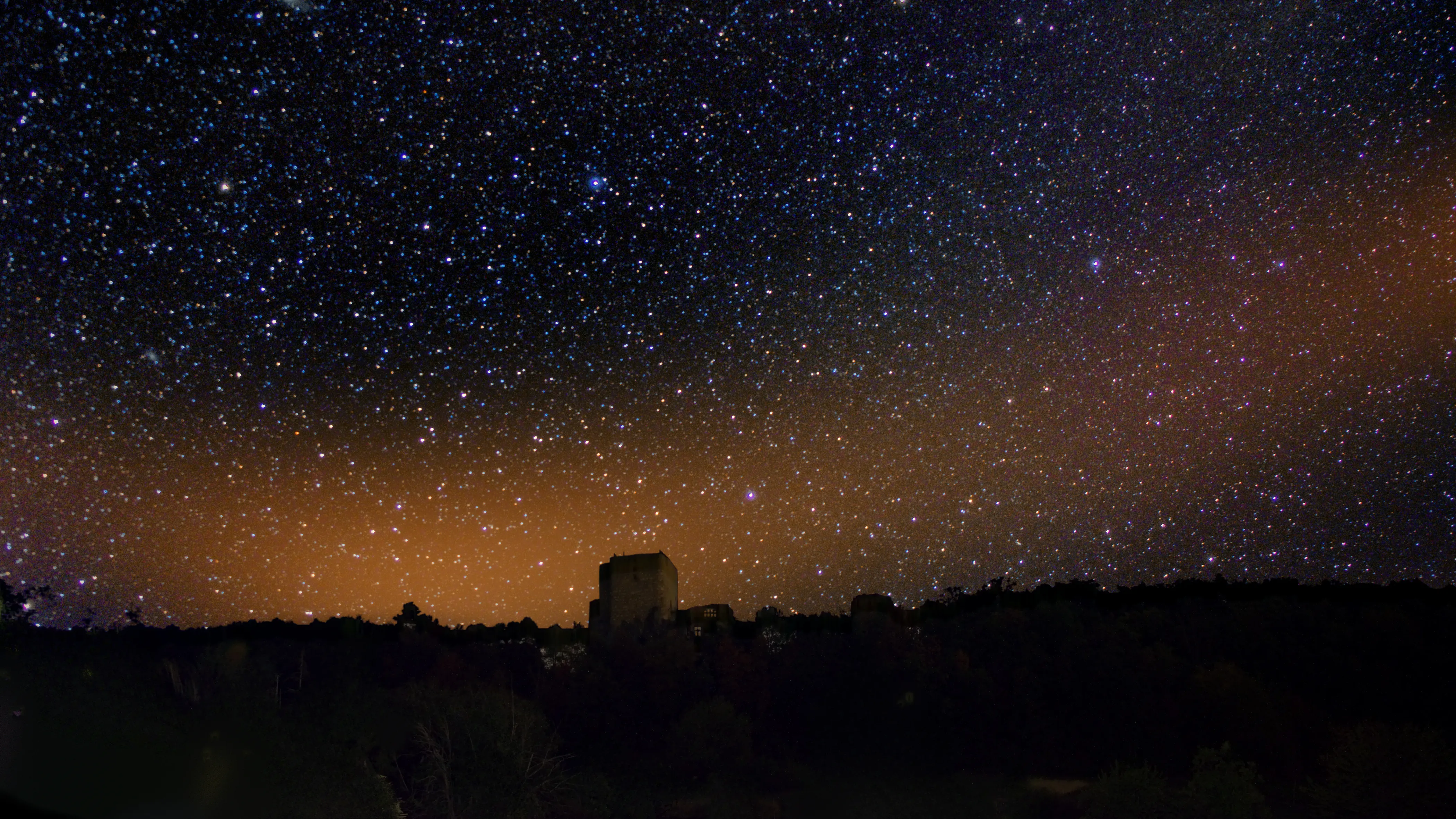 [Placeholder for the long-exposure photograph of the night sky.]